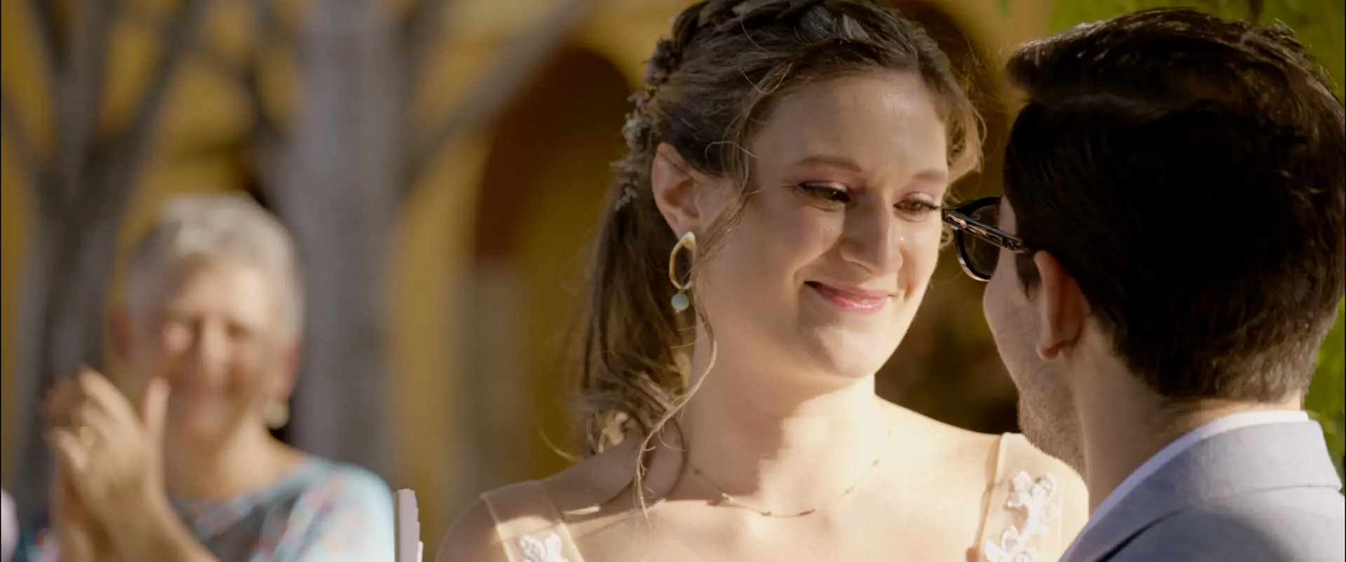 María smiling at Fernando during their wedding ceremony at Hacienda Xtepen, Mérida.