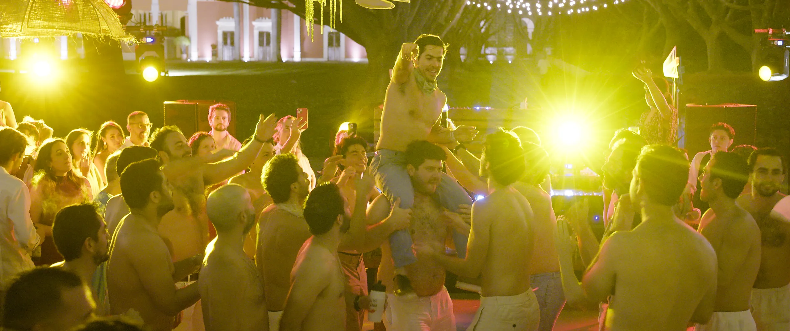 Guests lifted on shoulders as the batucada plays during the reception at Hacienda Xtepen.